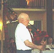 Reverend William Huntley playing the bagpipes