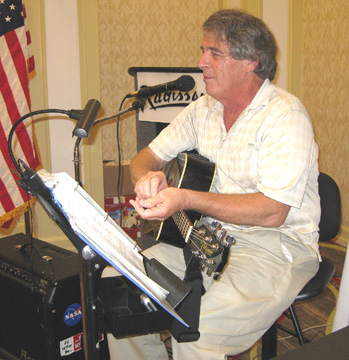 Ray playing a guitar