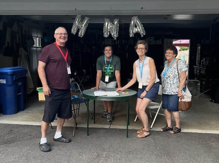 Four Huntlys in front of a garage