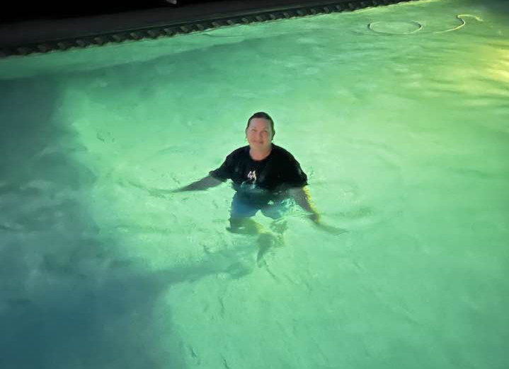 A woman swims alone in a pool