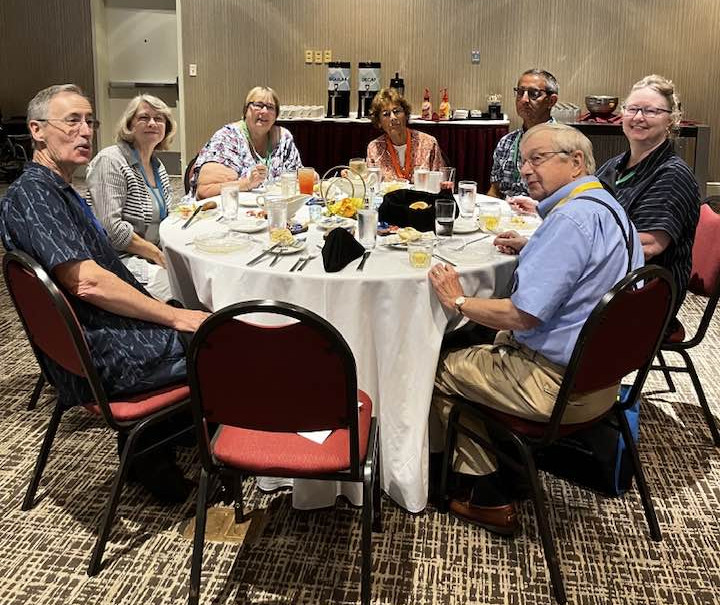 Tableful of 7 attendees